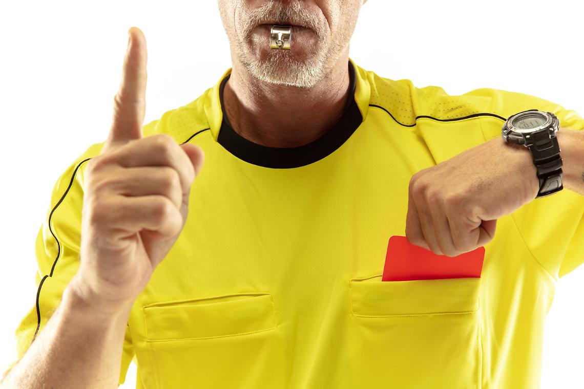 referee-showing-a-red-card-to-a-displeased-football-or-soccer-player