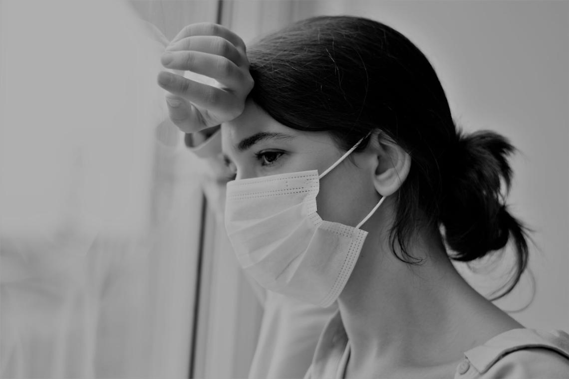 Woman wearing a face mask during at home