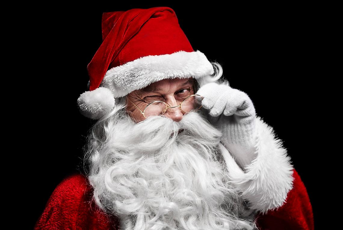 man-in-santa-claus-costume-winking